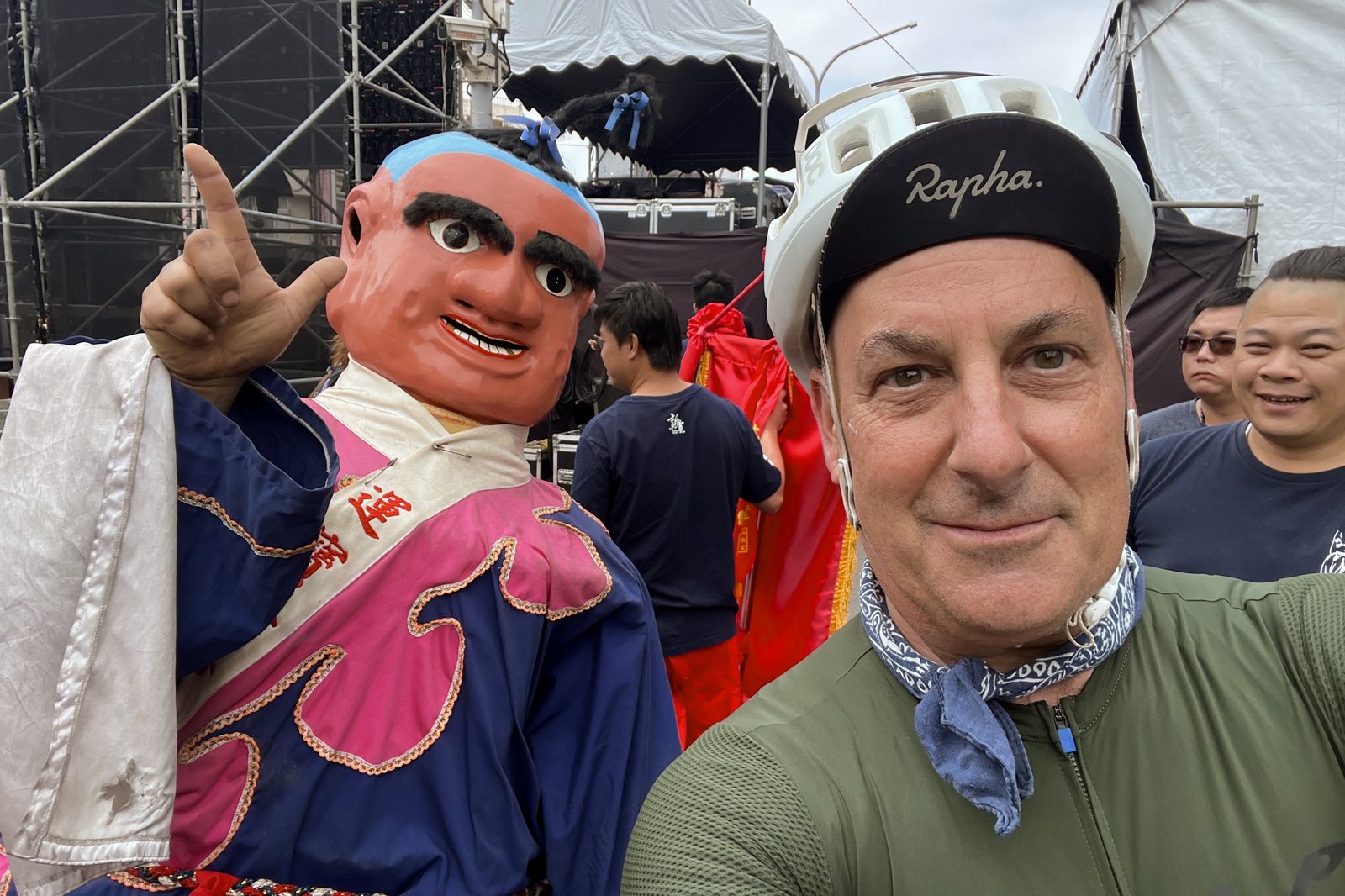 A selfie with a towering parade puppet
