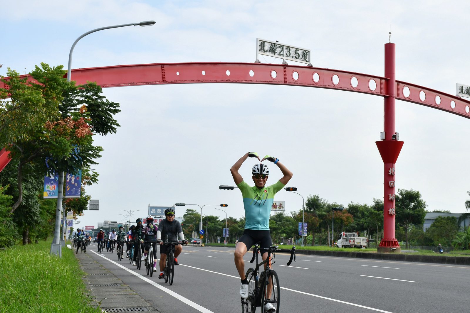 A heart-shaped pose under the Tropic of Cancer arch