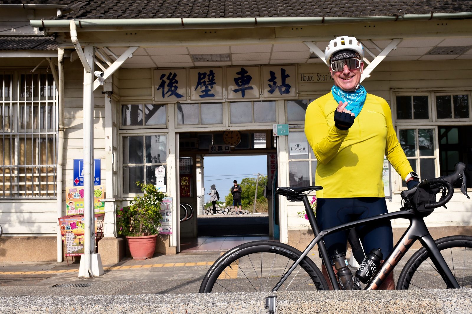 A finger-heart pose outside Houbi Station