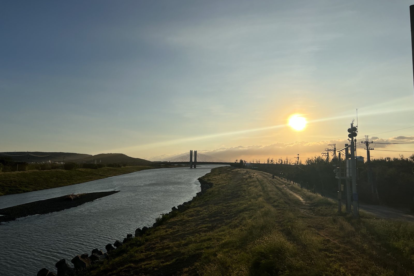 Sunrise over the river and its cable-stayed bridge