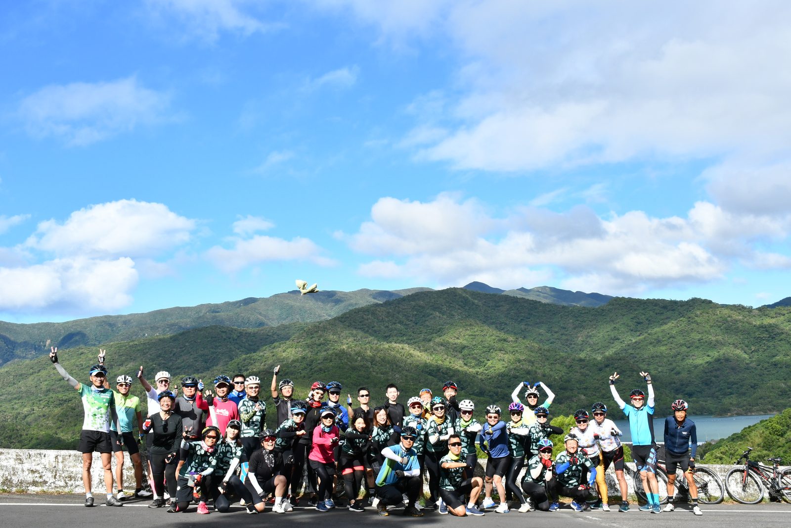 The whole tour posed on the causeway wall