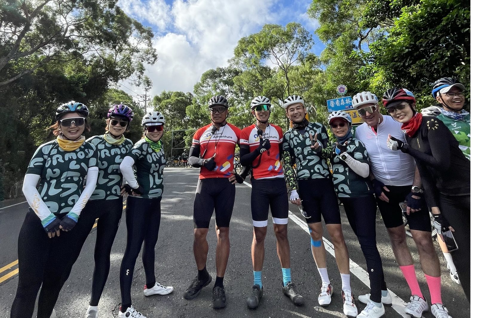 A sunny group photo at a road junction