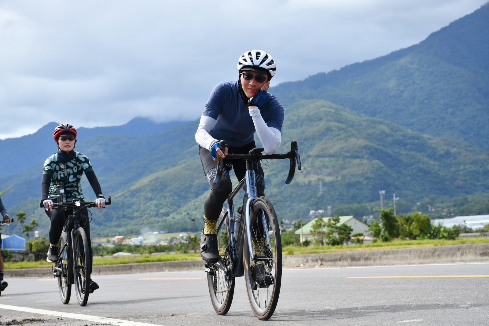 Resting a chin on the handlebar, all smiles