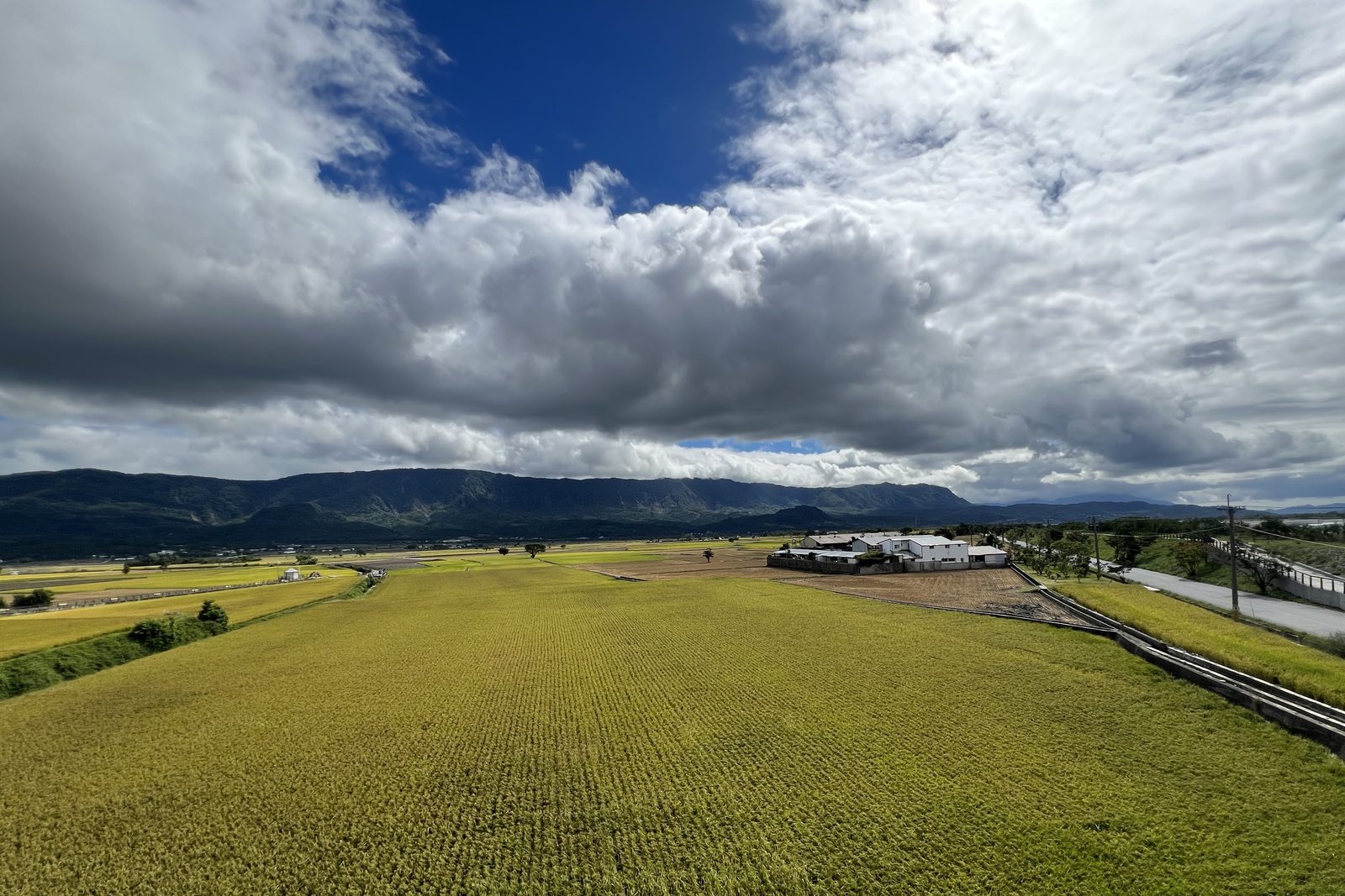 A wide view over the valley's patchwork fields