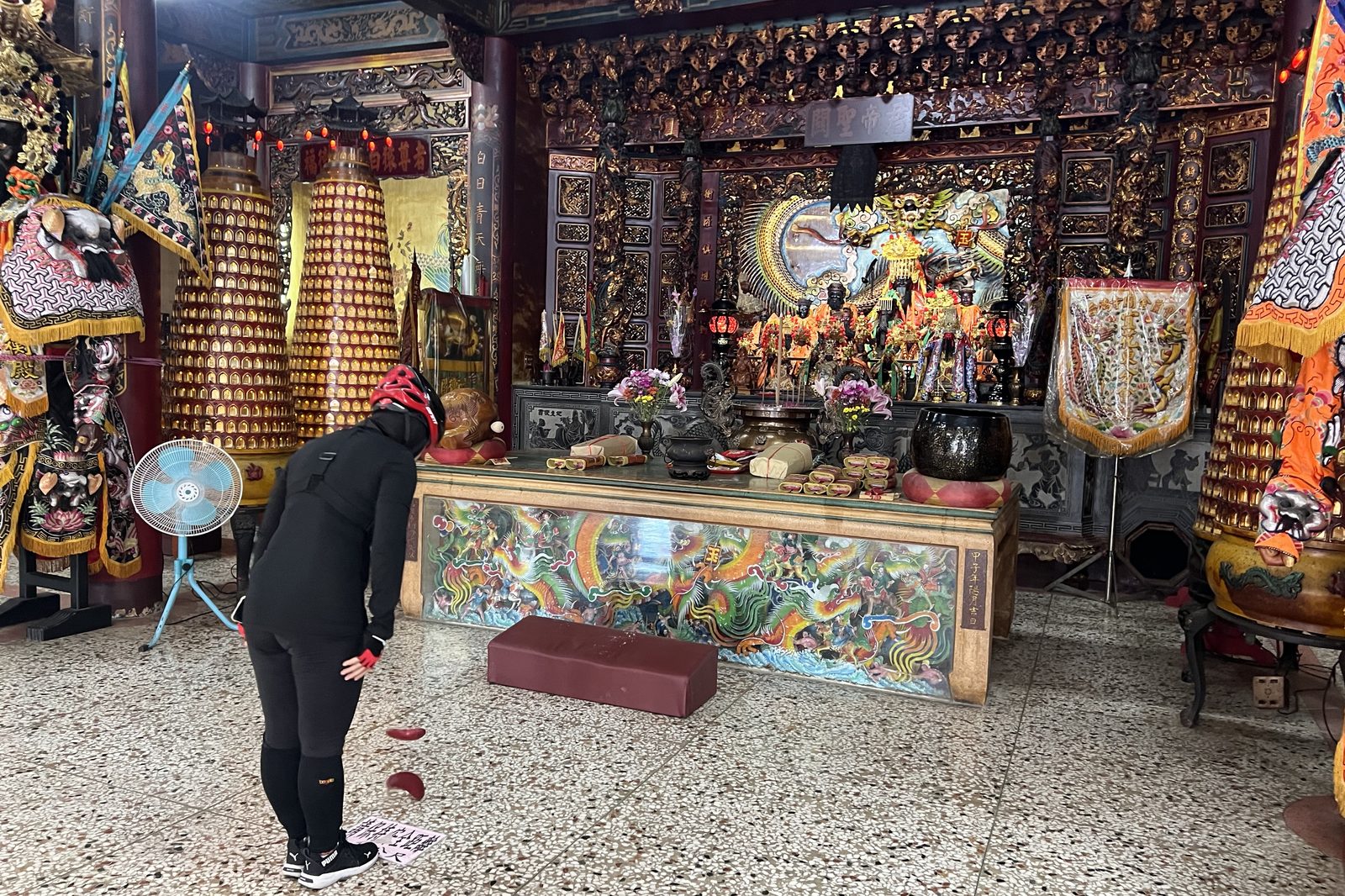 Paying respects at a roadside temple
