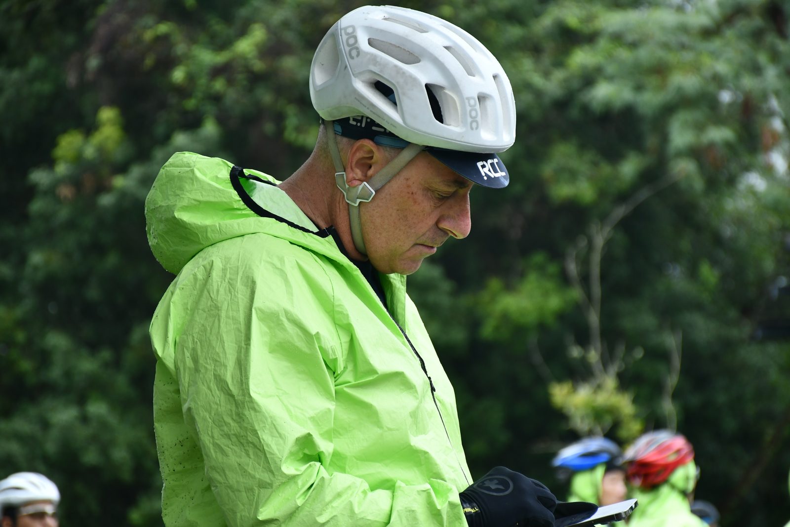 Checking a message before pressing on in the rain