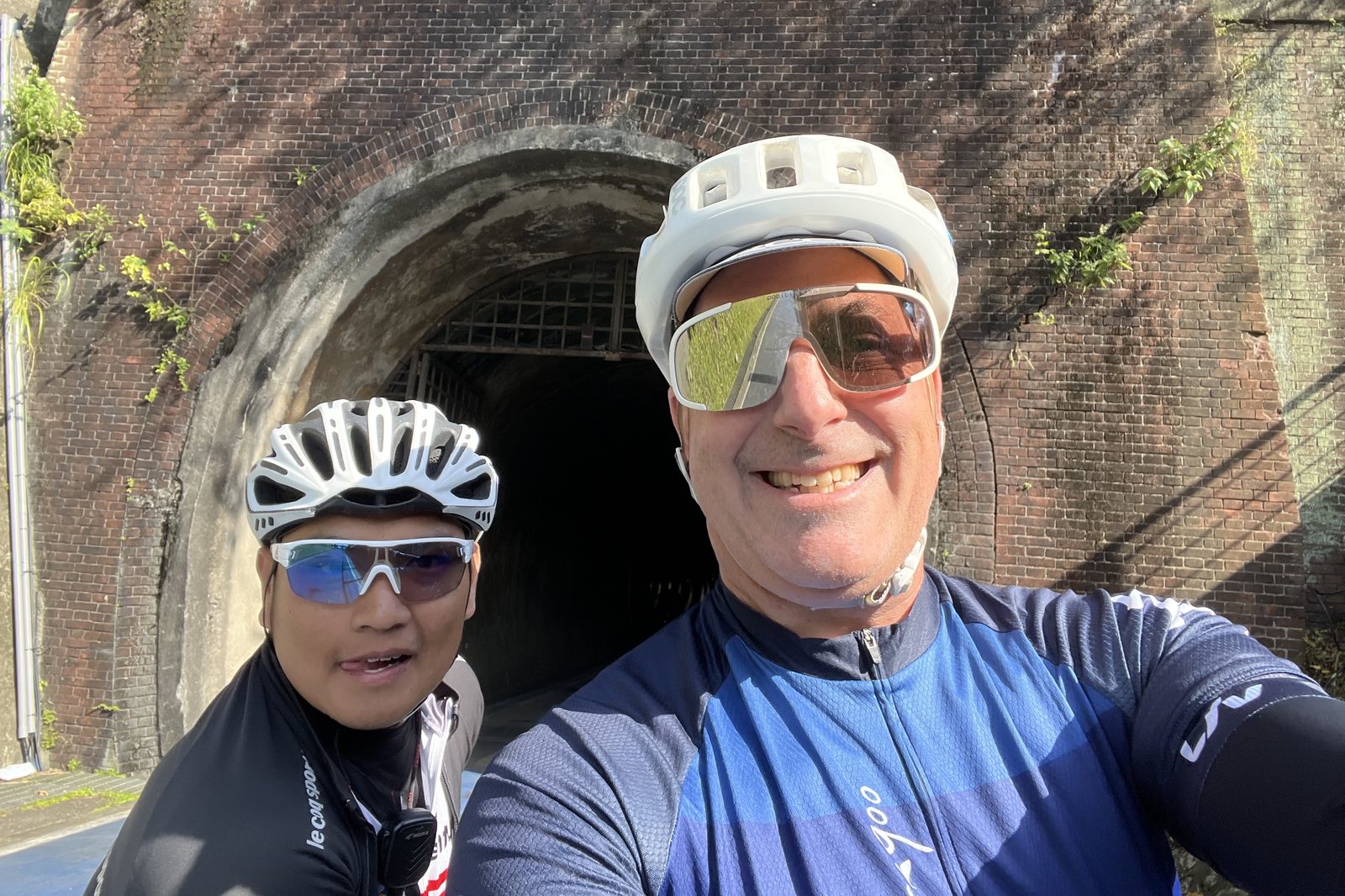 A selfie in front of an old brick tunnel