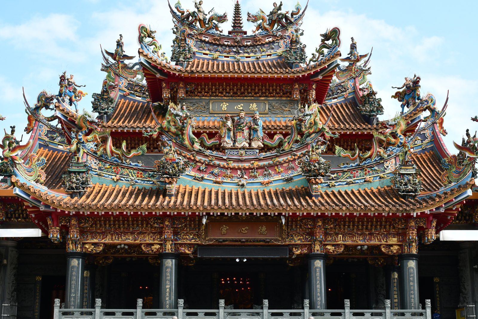 A close look at an ornate temple roofline