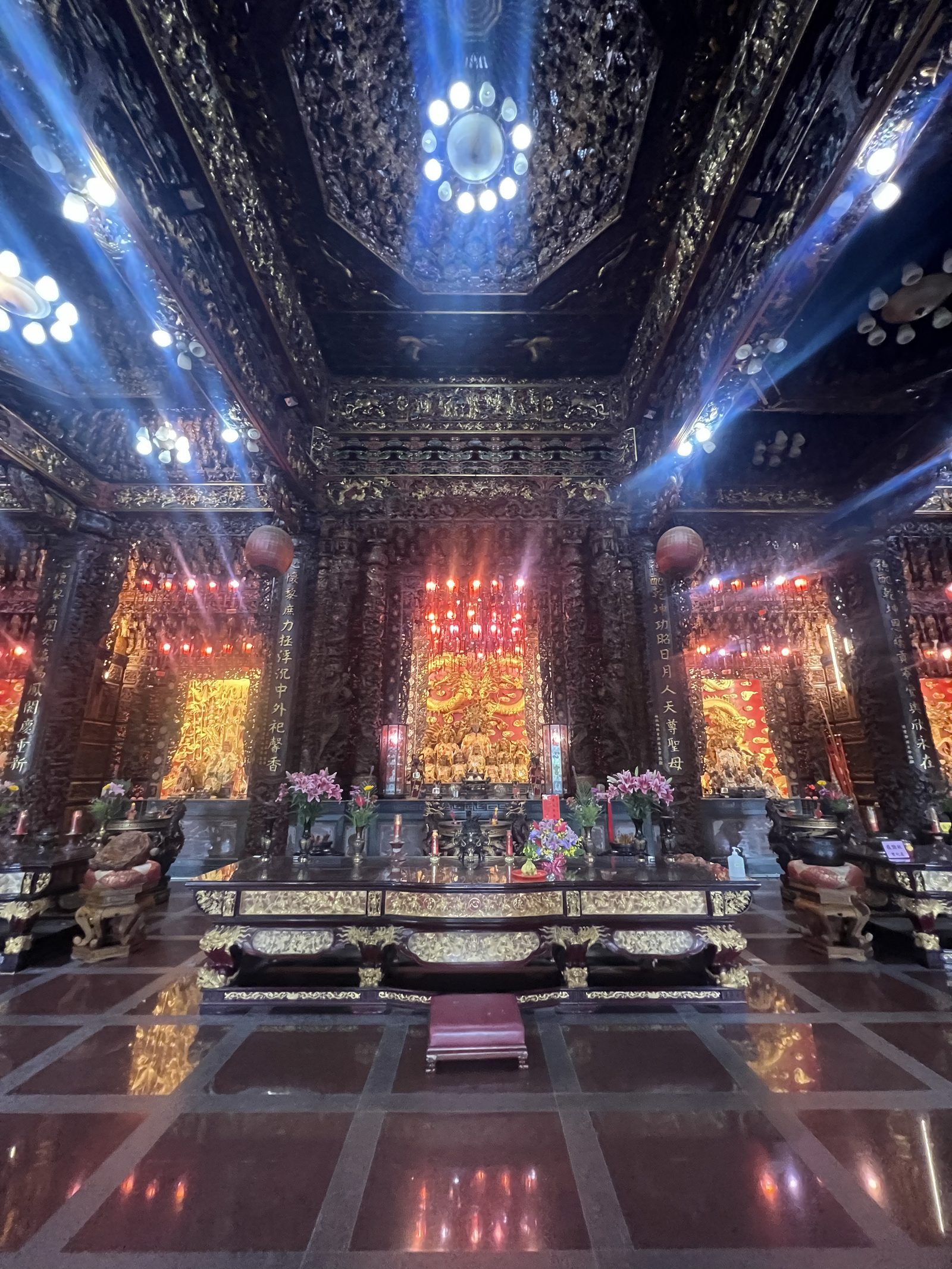 The temple's golden altar, lit in red