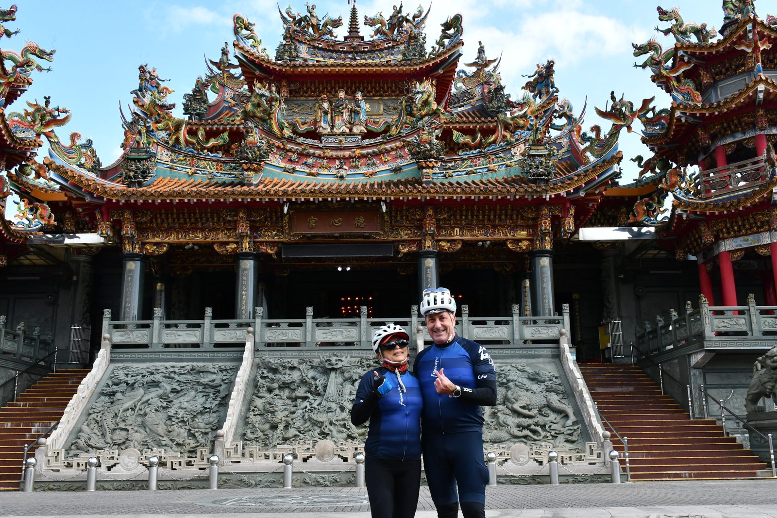 A thumbs up at the temple